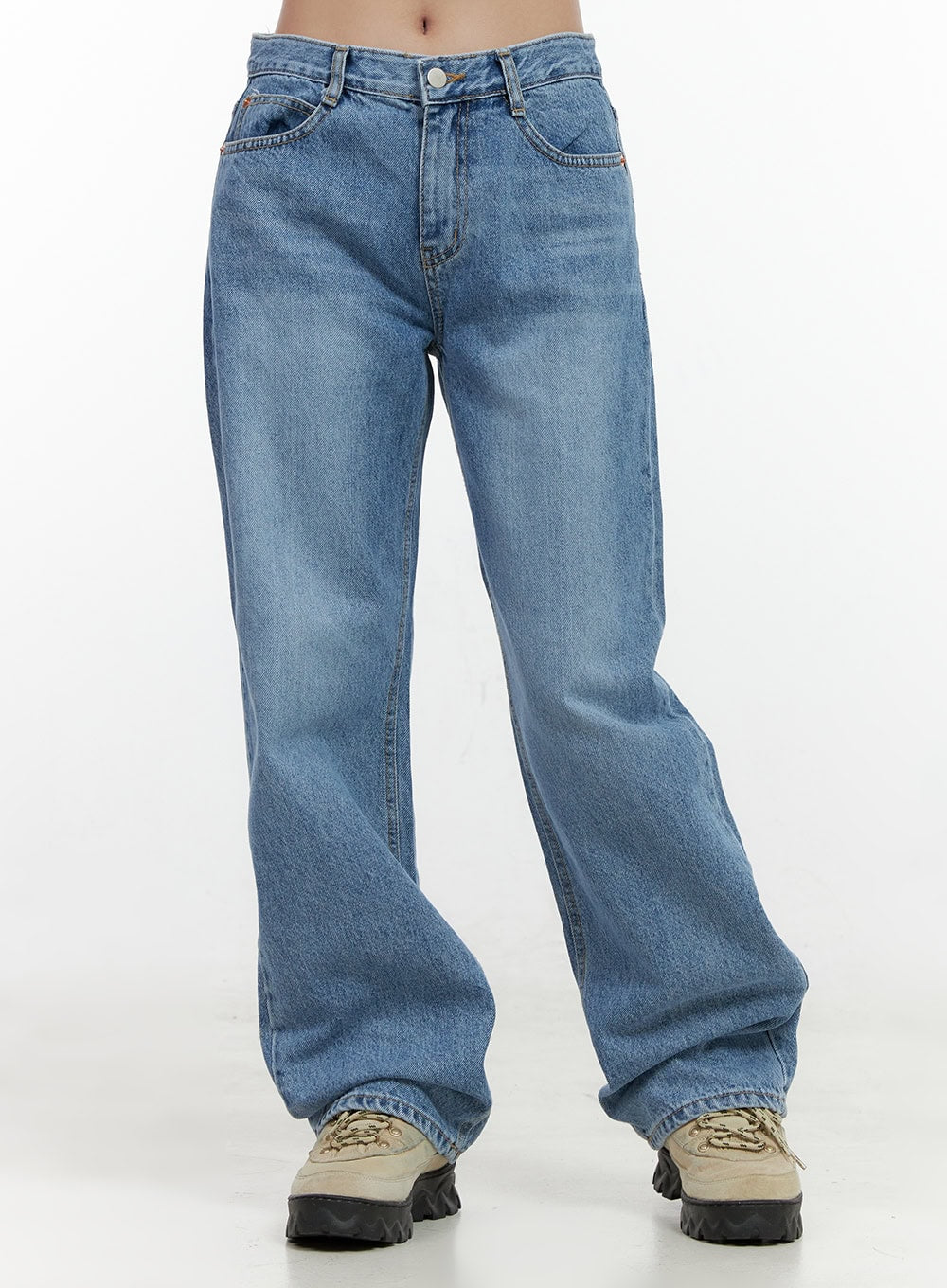 Carly Cloud Wide-Leg Jeans ON404 in blue, front waist-to-hem product shot on model, washed denim with button closure, belt loops, and wide straight leg pooling over chunky sneakers.