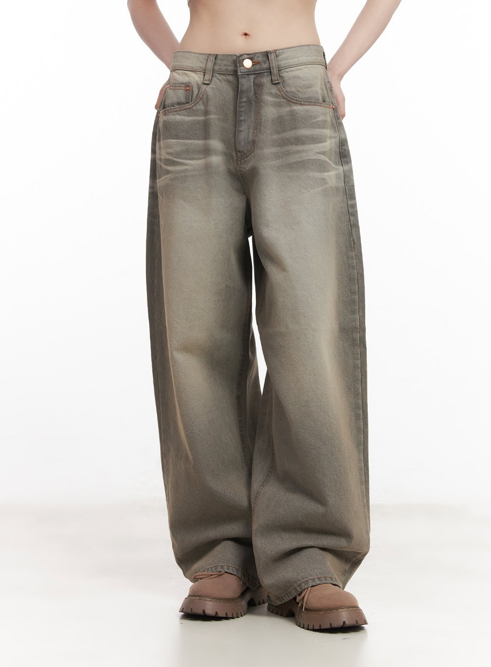 Joey Washed Wide-Leg Jeans CM528 in gray, front waist-down shot on model with hands in pockets, emphasizing wide baggy fit, faded washed denim gradient, and contrast orange pocket stitching detail.