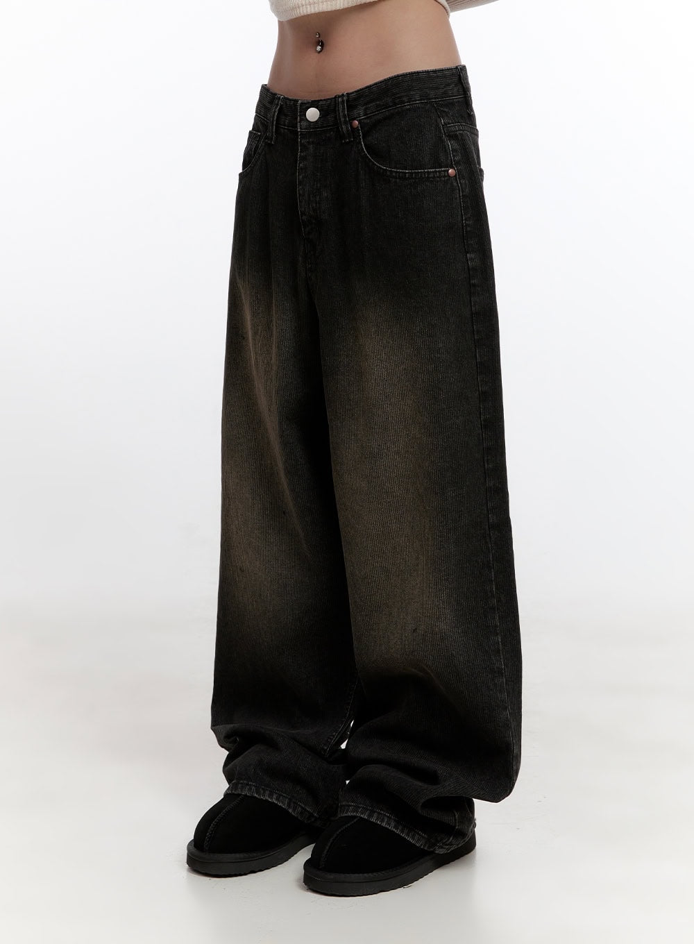 Sabina Low Waist Wide Fit Denim Jeans CN425 in Black, side waist-down detail shot on model, close view of low waist button closure, washed brown-to-black gradient fade across wide voluminous leg, hem stacking over slides.