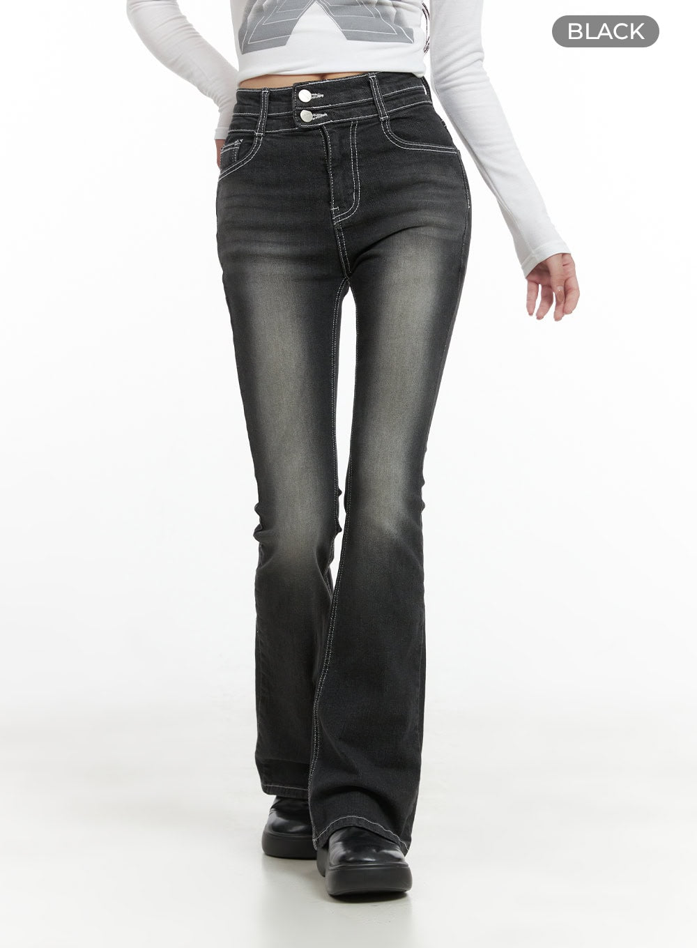 Gigi Two-Button Slim Bootcut Jeans CG421 in black, cropped front walking shot on model, close view of two-button high waist and contrast white topstitching, washed bootcut denim with slight fade at thigh.