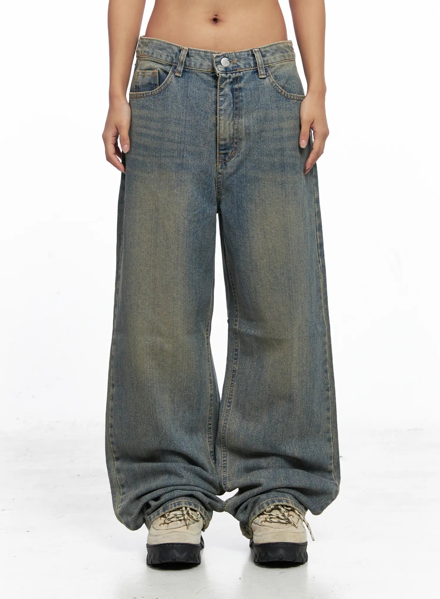 Denver Vintage Washed Semi-Wide Jeans CO513 in blue, front full-length product shot on model, wide semi-relaxed fit, low-rise waist, vintage washed cotton denim, hem stacked over chunky sneakers.