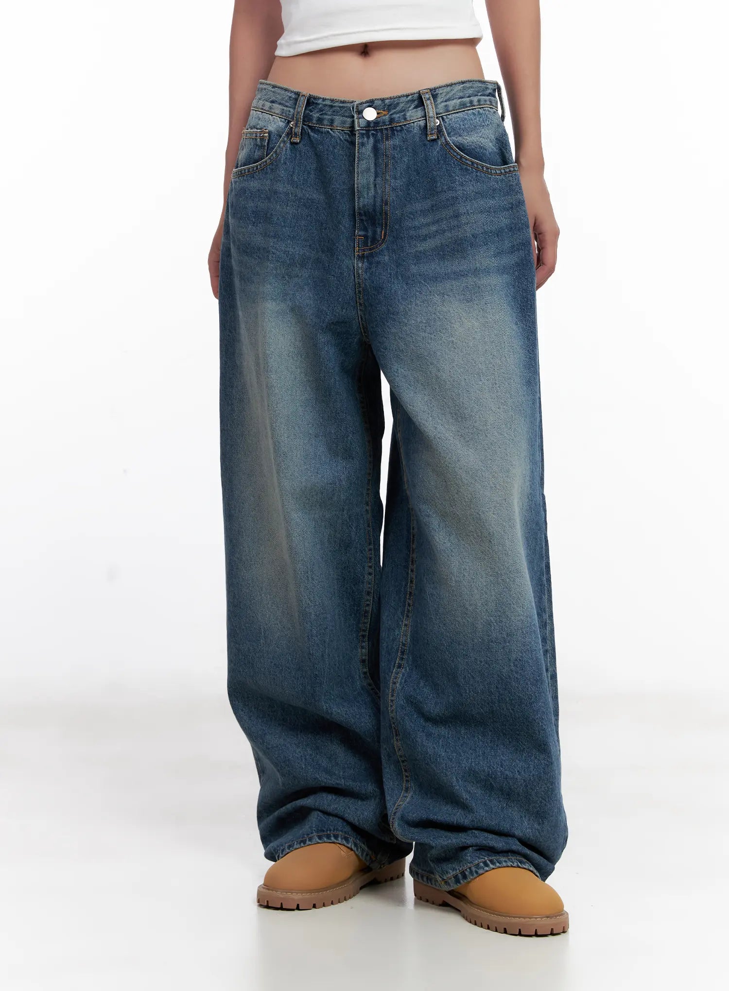 Miji Wide-Leg Washed Denim Jeans CL521 in dark blue, front waist-to-hem close-up on model, five-pocket construction, button fly, washed cotton with golden fade, oversized wide-leg silhouette.