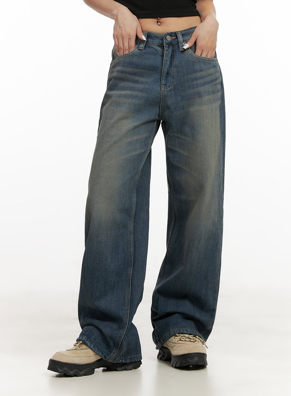 Michelle Washed Wide-Leg Jeans CJ508 in blue, front waist-down shot on model hands in pockets, washed cotton denim with low-rise fit and broad wide leg, paired with chunky sneakers.