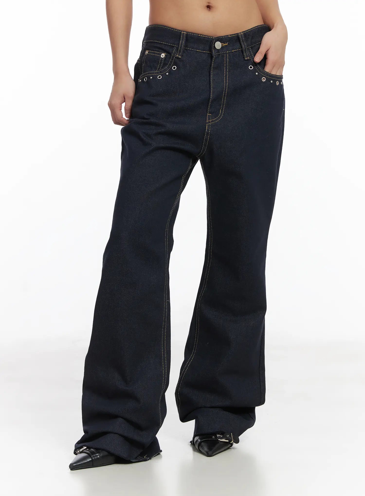 Bunn Non-Fade Eyelet Bootcut Jeans CJ512 in dark blue, front three-quarter crop shot on model, eyelet-trimmed pockets, contrast topstitching, wide bootcut flare visible from hip to hem.