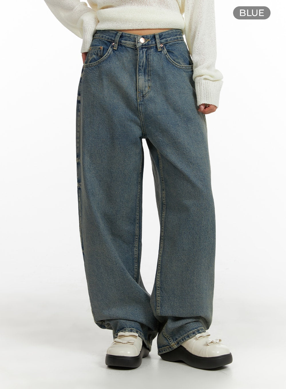 Urban Chic Washed Baggy Jeans CM411 in blue, front mid-shot on model, wide-fit washed denim with mid-rise waist, five-pocket design, and straight wide leg, styled with cream knit.