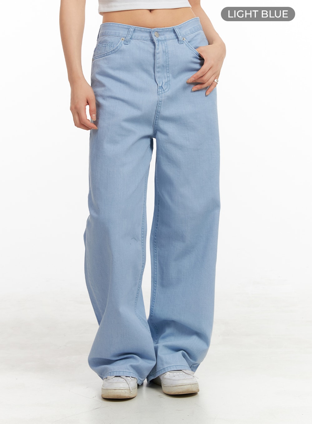 Solid Cotton Loose Fit Straight Jeans OA429 in light blue, front waist-to-hem close-up on model, low-rise five-pocket detail, wide loose leg, solid light blue cotton denim fabric.