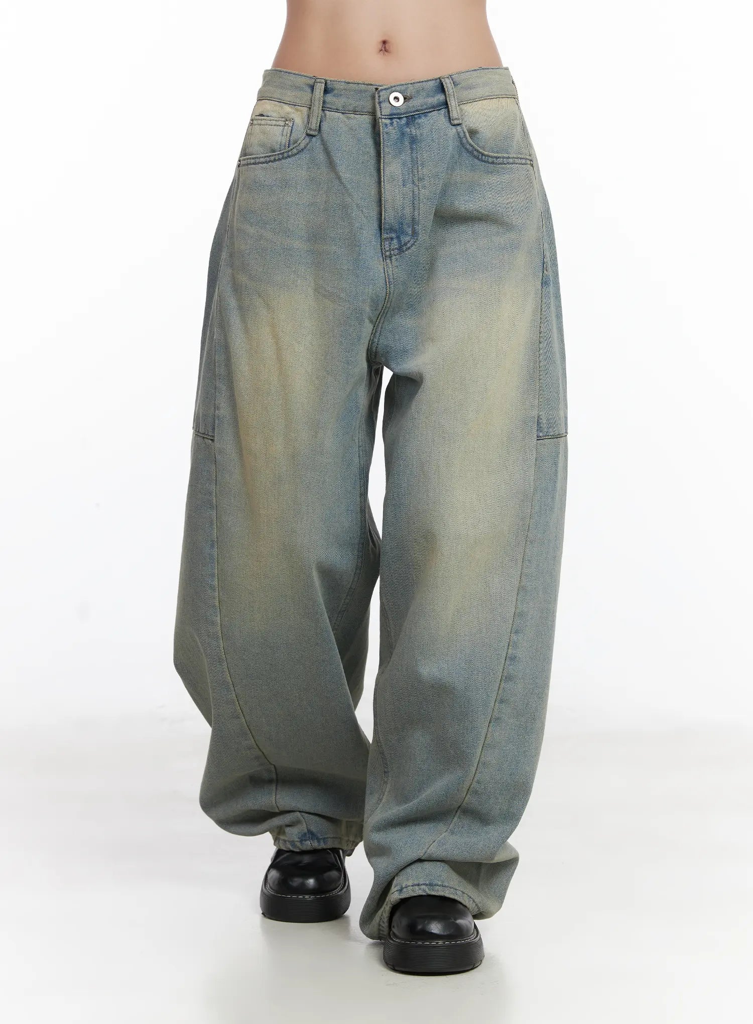 Lyla Washed Wide Leg Jeans CD530 in light blue, front waist-to-hem shot on model, low-rise button waistband, front pockets, curved panel seam, and voluminous wide leg washed denim silhouette.