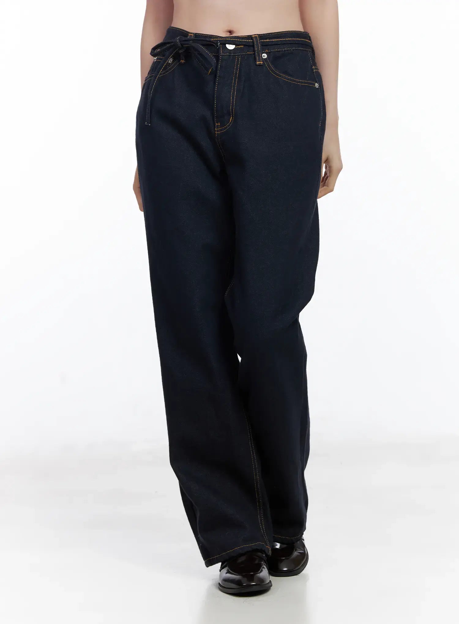 Mingi Non-Fade Semi-Wide Belted Jeans CJ519 in dark blue, front three-quarter product shot on model, belted waist with tie knot, contrast topstitching, wide-leg cotton denim, long inseam.