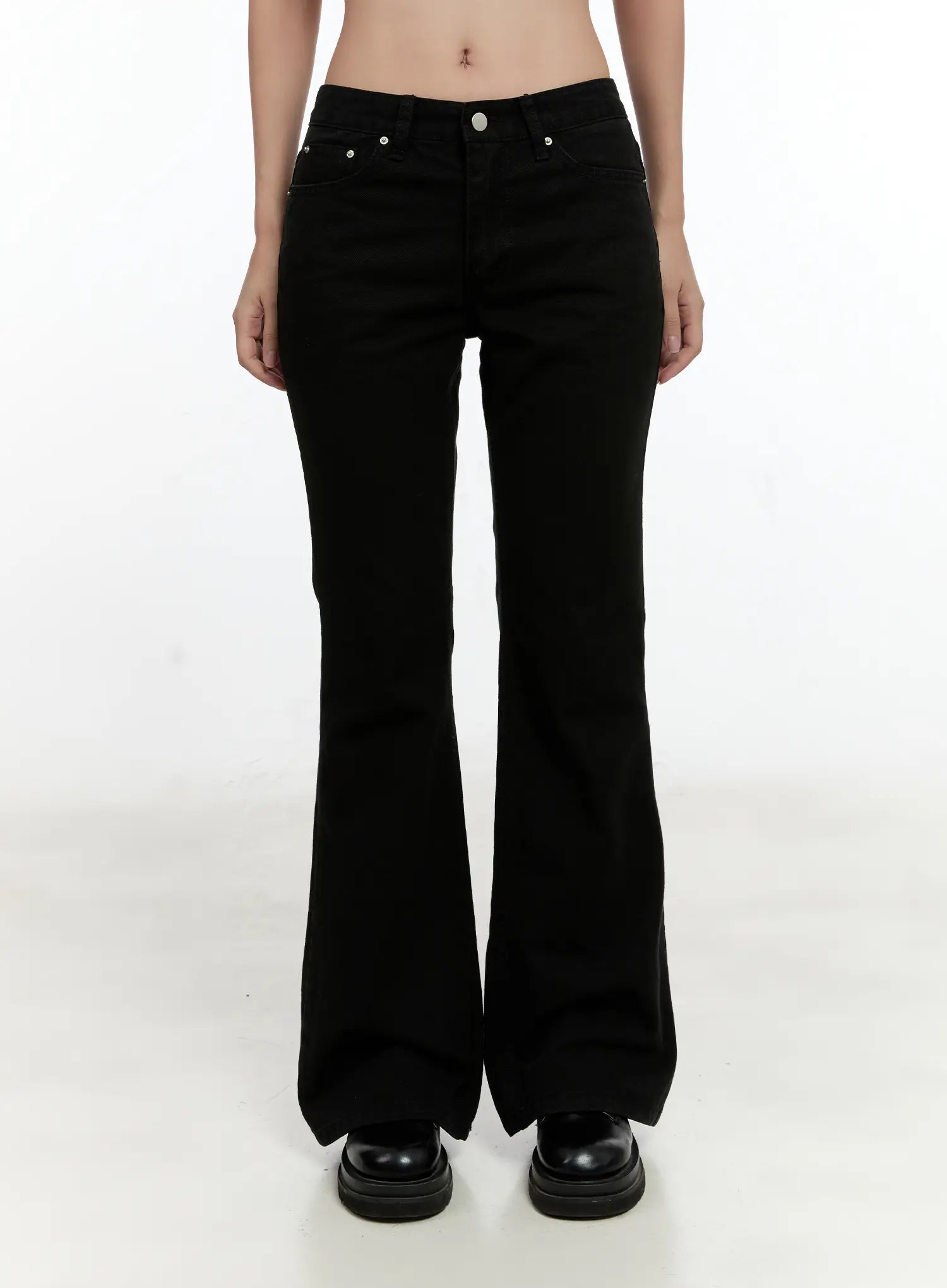 Classic Flare Pants CL531 in black, front cropped shot from waist to hem on model, five-pocket design with silver rivets and mid-rise waistband visible.