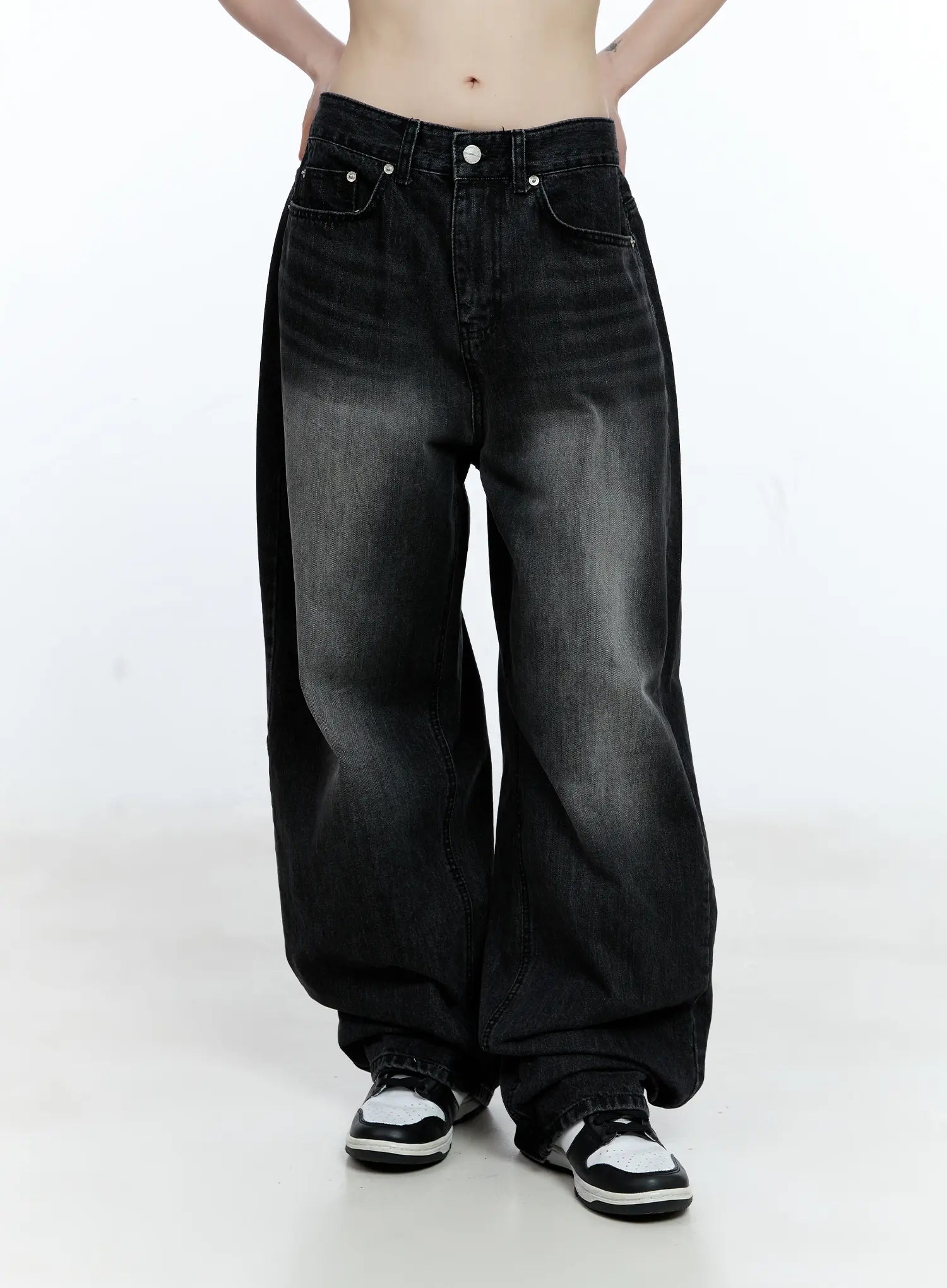 Gayeon Washed Wide-Leg Jeans CG507 in black, front cropped product shot from waist down, washed black cotton wide-leg silhouette, five-pocket design, pooling hem on sneakers.