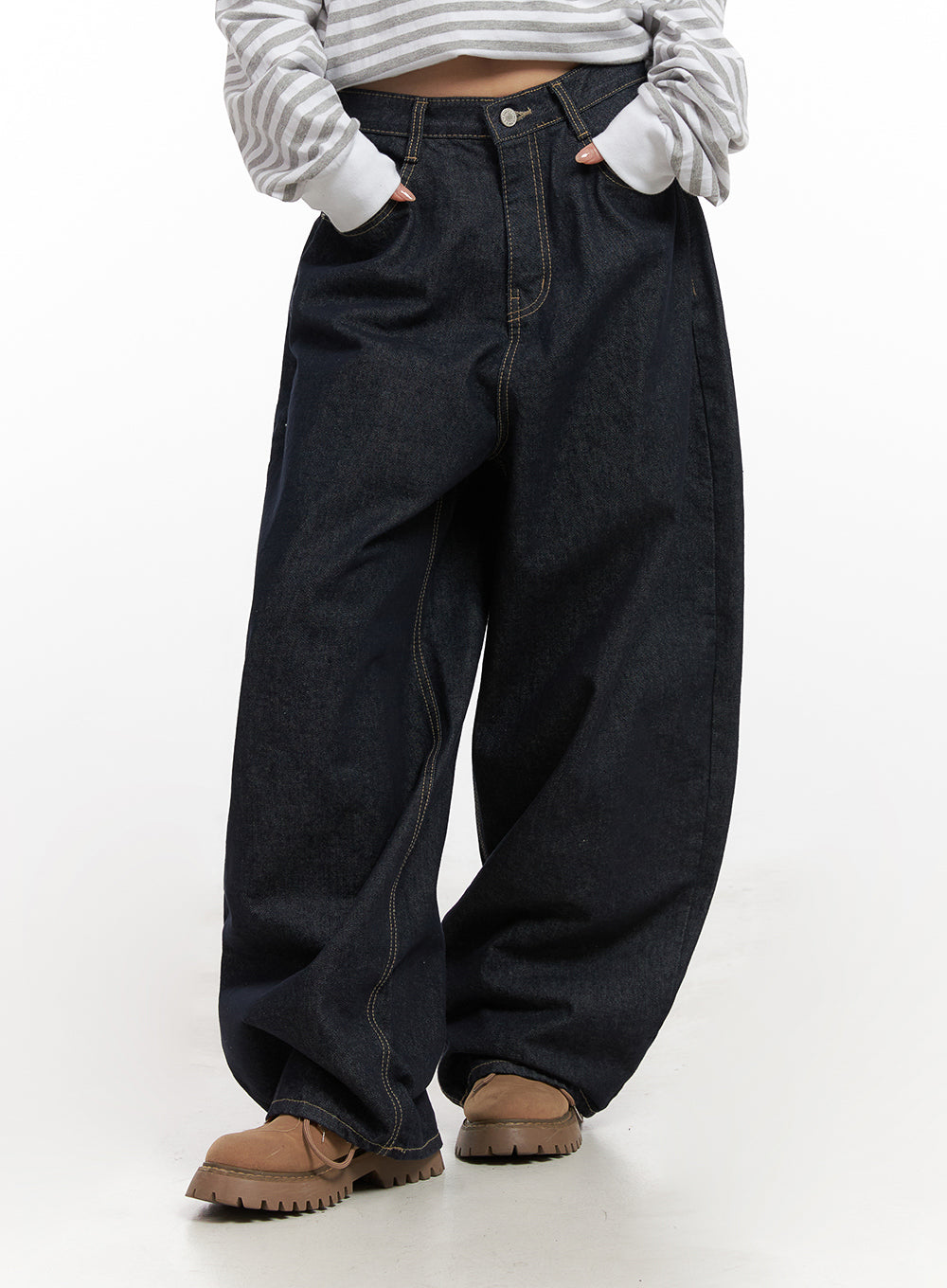 Lily Stitched Wide-Leg Jeans CN426 in dark blue, front mid-shot on model, hands tucked in pockets, high-rise waist with button fly and contrast stitching, ballooned wide-leg cotton denim.