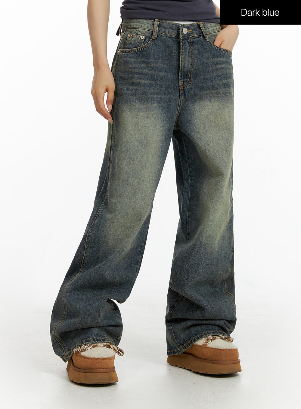 Washed Baggy Jeans CF416 in dark blue, front three-quarter view on model, mid-rise waistband, wide-leg cotton denim with vintage yellow-toned fading.