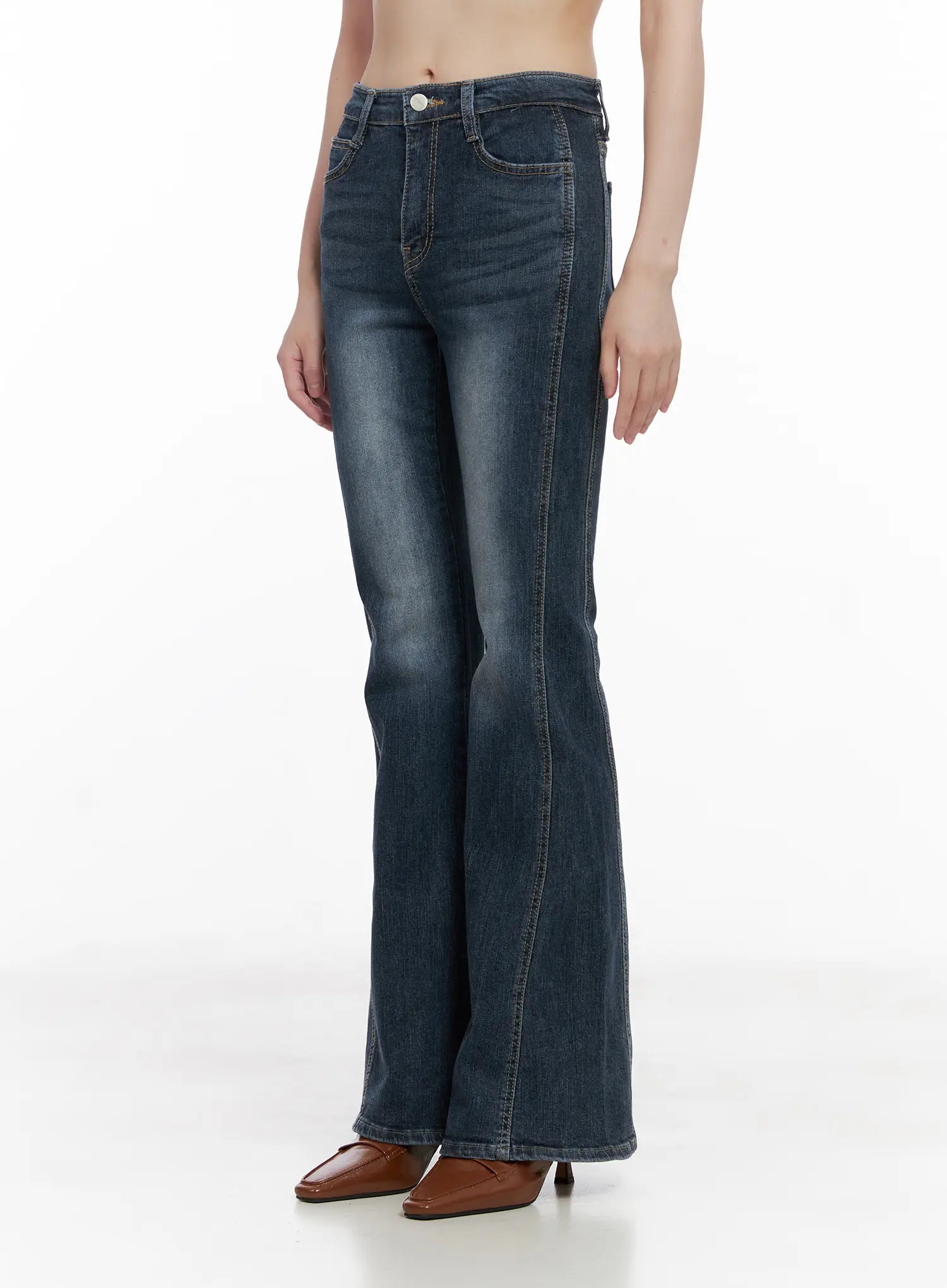 Giana High Waist Hip Pad Flare Jeans CG519 in blue, angled front view on model, slim-fit high waist with washed finish, flare bootcut leg, brown square-toe heels.