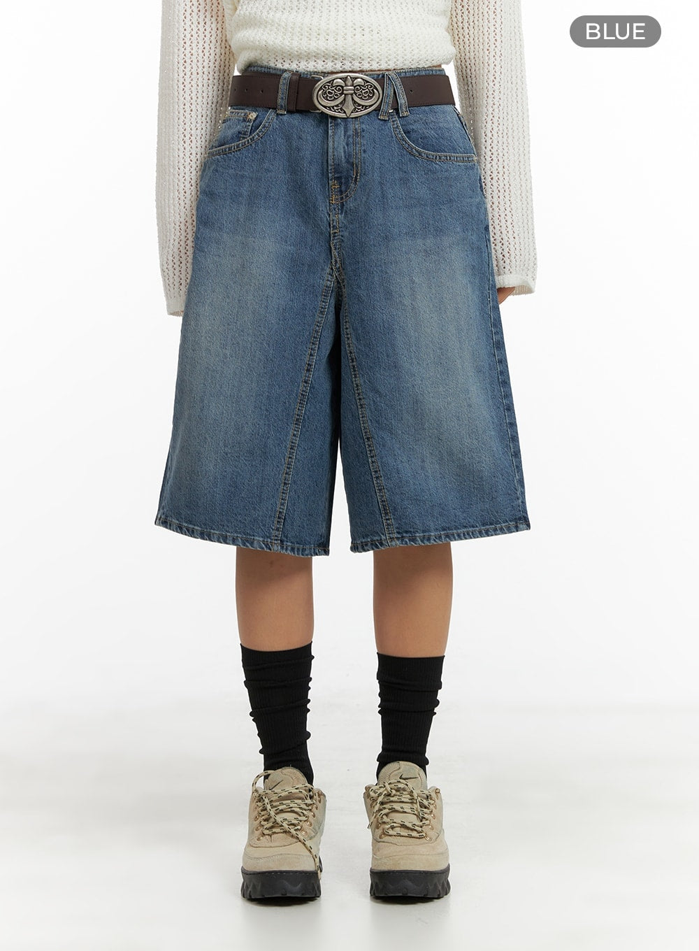 Vintage Washed Wide Leg Jorts CA415 in blue, front product shot on model, wide-fit knee-length denim jorts with vintage wash, high-rise waist, silver statement belt, and black layered socks.
