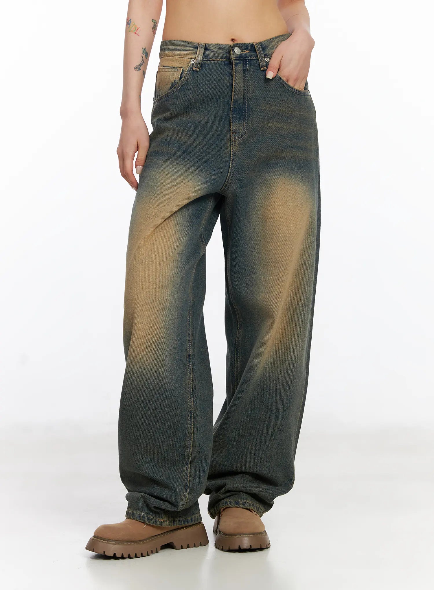 Karsyn Vintage Baggy Jeans CJ522 in dark blue, side-front angle on model with hand in pocket, showcasing baggy wide-leg shape and bold amber sun-fade on dark cotton denim.