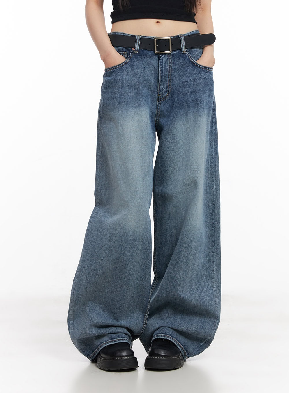 Pauline Wide-Leg Baggy Jeans CY512 in blue, front mid-shot on model hands in pockets, washed blue denim, extreme wide baggy leg with pooling hem, black square-buckle belt.