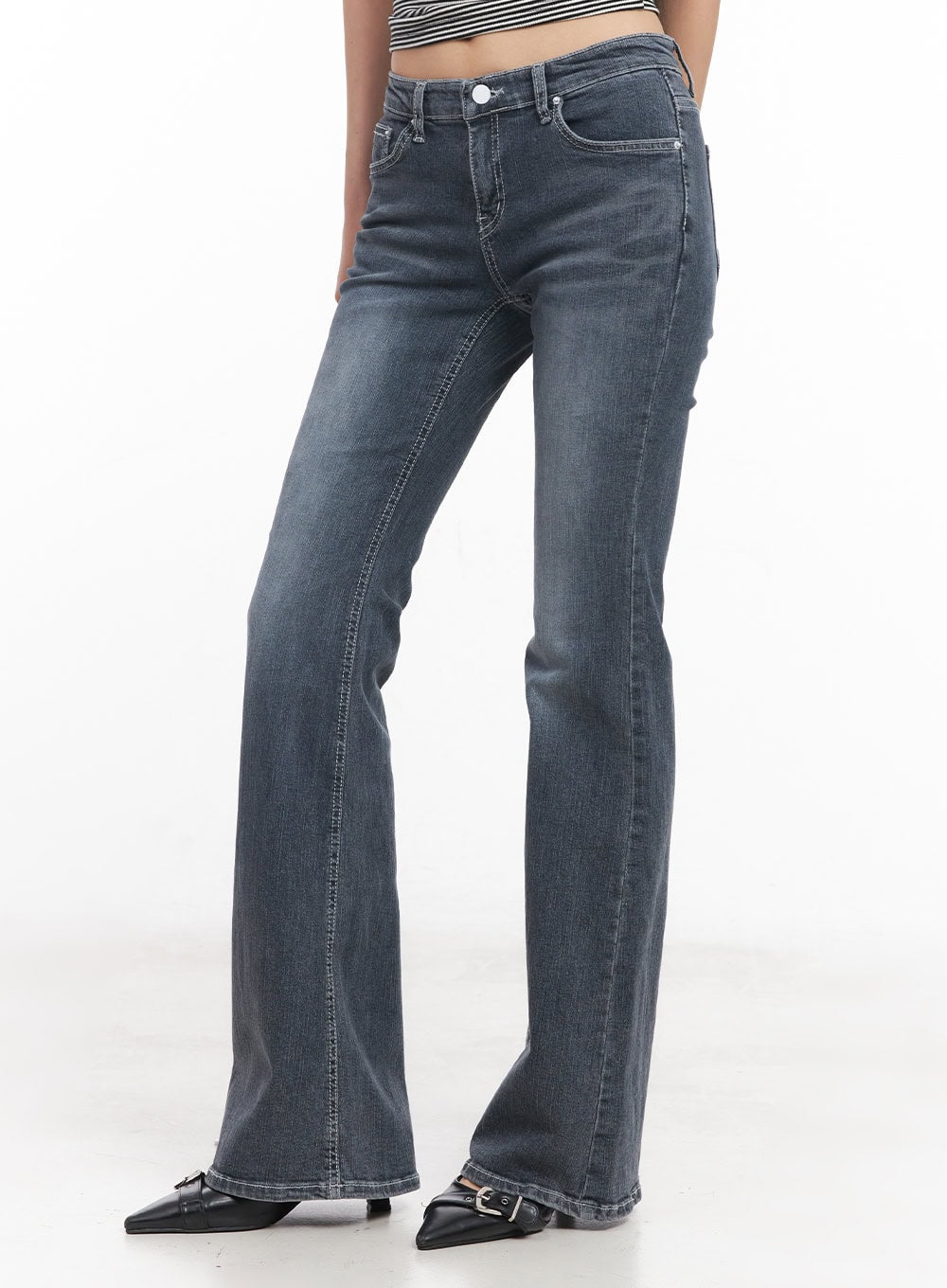 Nadeline Slim Bootcut Jeans CY528 in dark gray, front three-quarter close-up on model, low-rise waistband with button closure, slim thigh through washed denim flaring at bootcut hem.