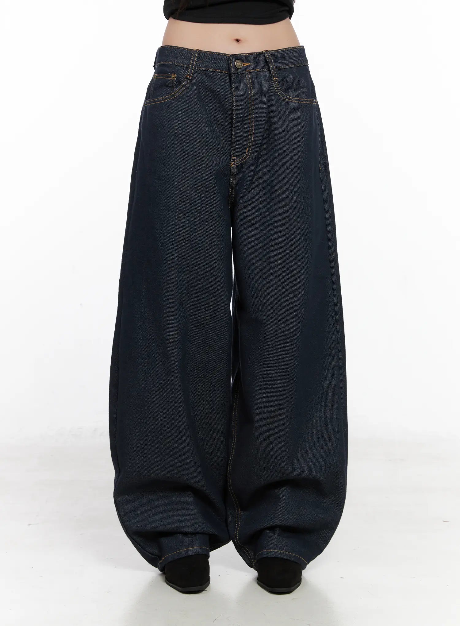 Heaven Wide-Leg Dark Washed Jeans CN513 in dark blue, front product shot on model, no outerwear, emphasizing exaggerated wide-leg hem pooling, mid-rise waist, and gold contrast stitching.