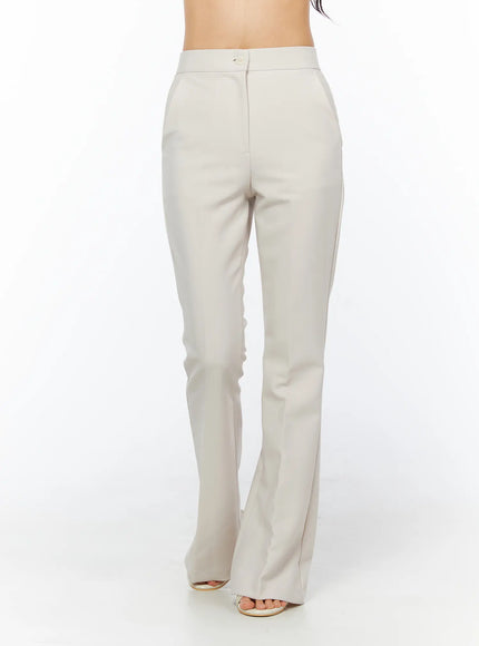 High-Waist Stretch Flared Slacks CU522 in light beige, front full-length product-focused shot, single button closure, center-front seam, fitted high waist with subtle flare at hem.