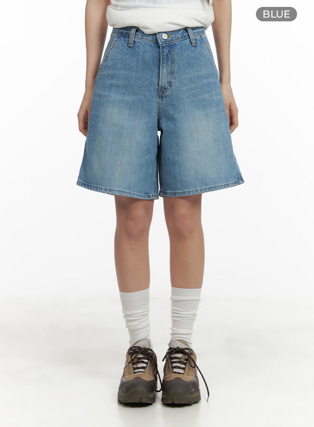 Washed Wide Leg Jorts CA409 in blue, front full-length on model, wide-fit washed denim, high waist, knee-length straight hem, styled with white socks and chunky sneakers.