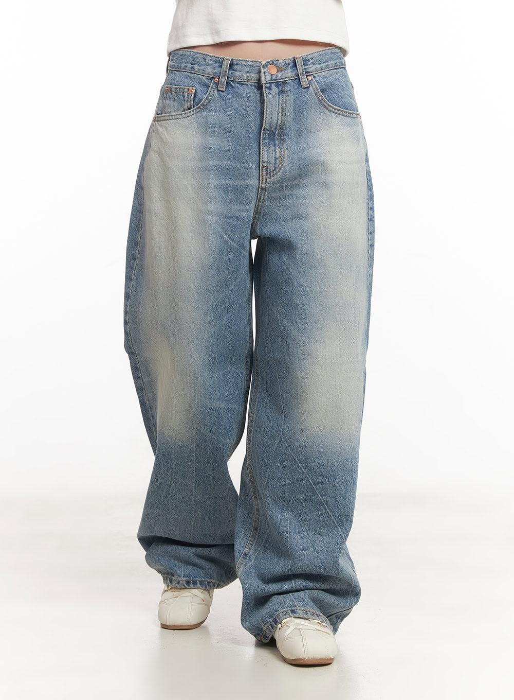 Lumira Back-Detail Washed Wide Leg Jeans CA530 in blue, front waist-down close-up on model, washed cotton denim with vintage fade, five-pocket styling, wide leg pooling at sneakers.