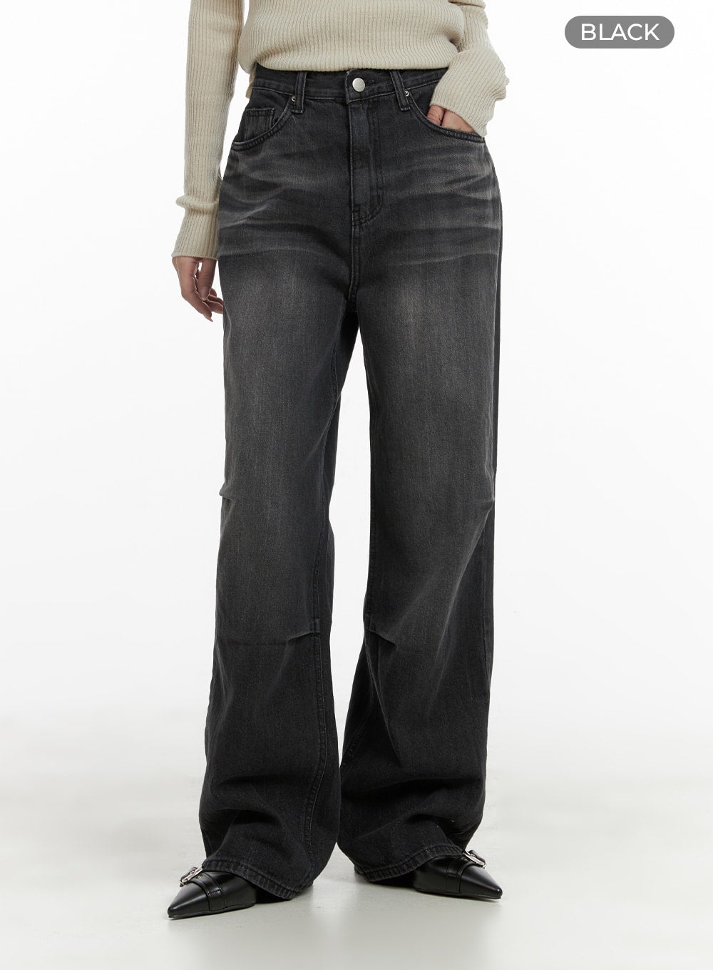 Pintuck Washed Wide Leg Jeans CA403 in Black, front product-focus shot on model, high-waist washed denim, pintuck crease detail across thigh, wide leg silhouette with black color label, styled with cream ribbed knit.