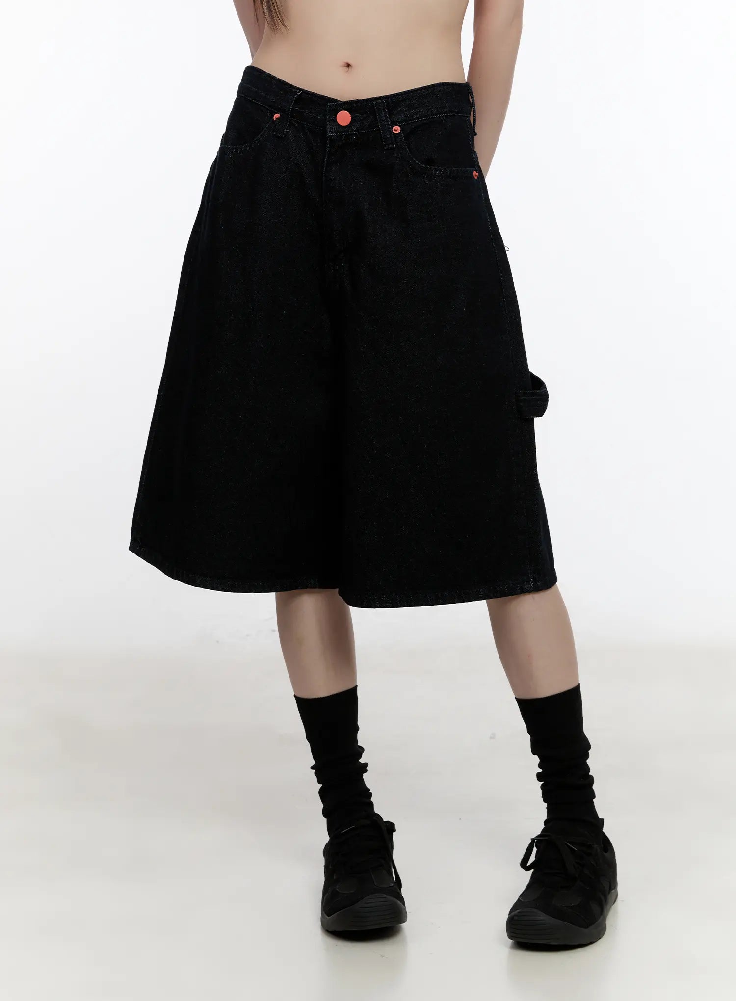 Red Text Graphic Embroidered Jorts CL504 in black, front waist-down view on model, wide-leg loose fit, red rivet buttons, front pockets, carpenter detail, half-length denim.
