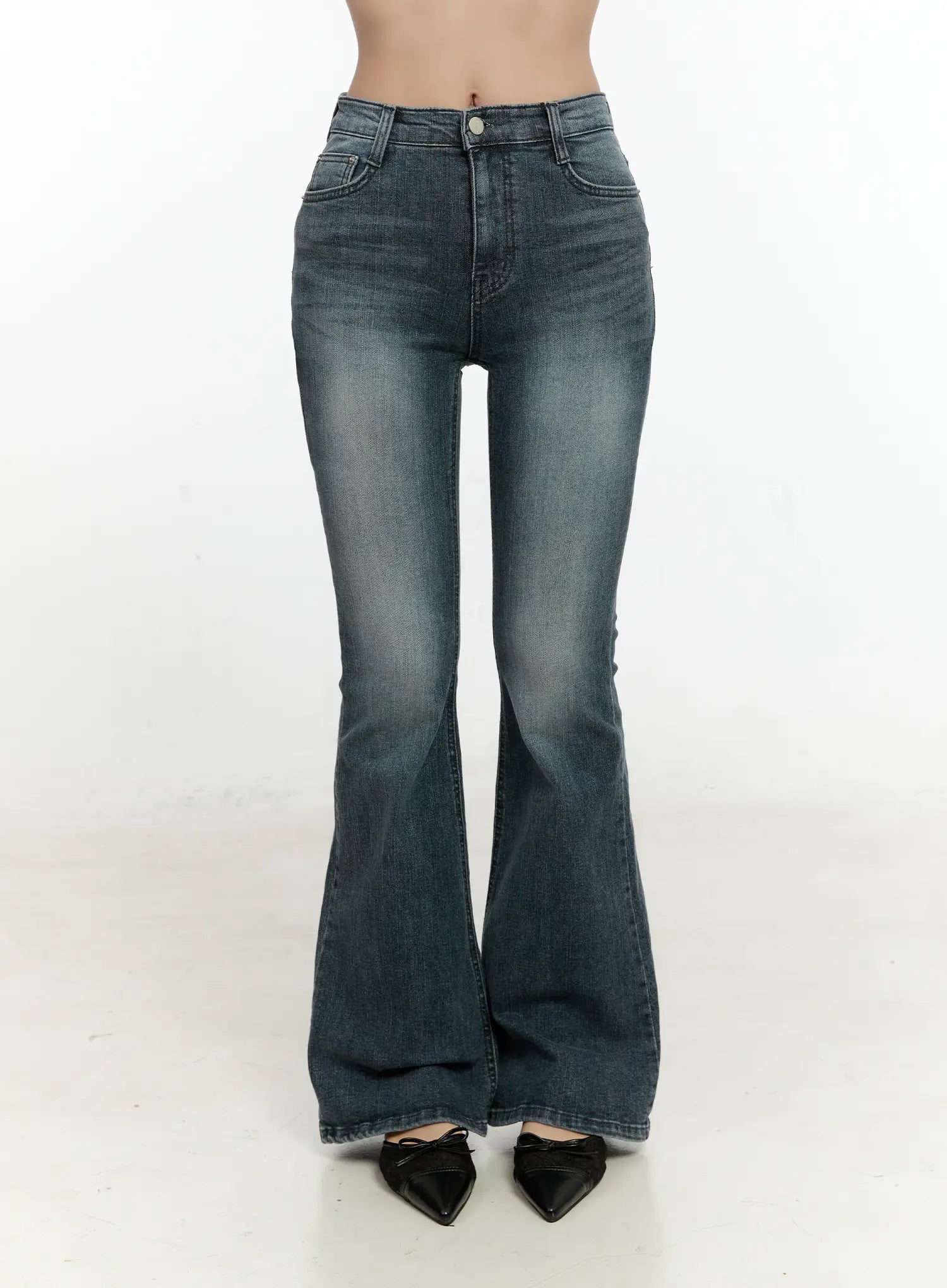Marley Hip-Pad Denim Bootcut Jeans CN506 in dark blue, front headless full-length shot on model, high-rise slim fit with bootcut flare to floor, washed fade detail, styled with black bow-detail flats.