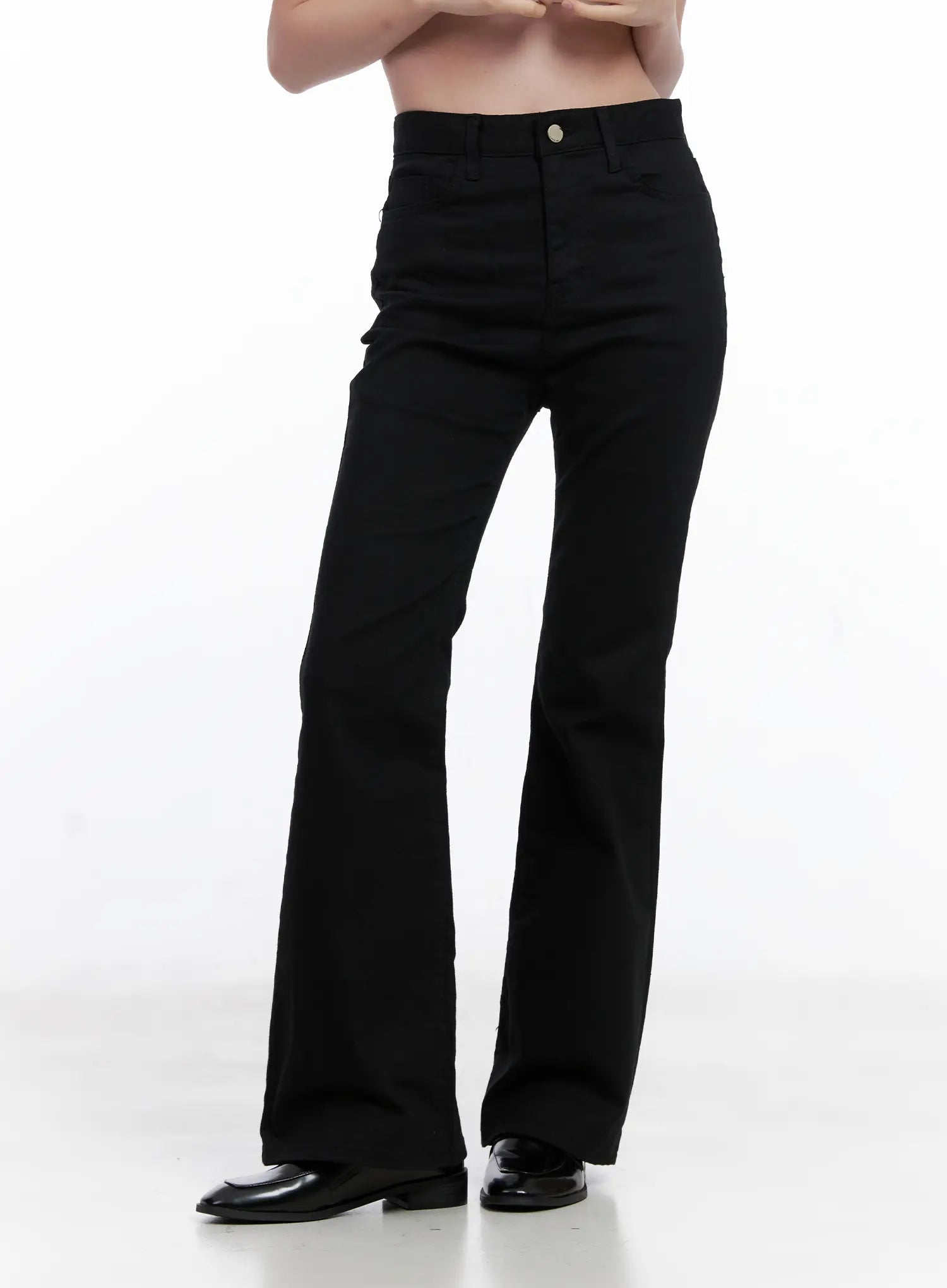 Casual Flare Cotton Pants CG521 in black, front three-quarter view on model, high-waist button closure, flare bootcut leg, solid black cotton blend, paired with black loafers.