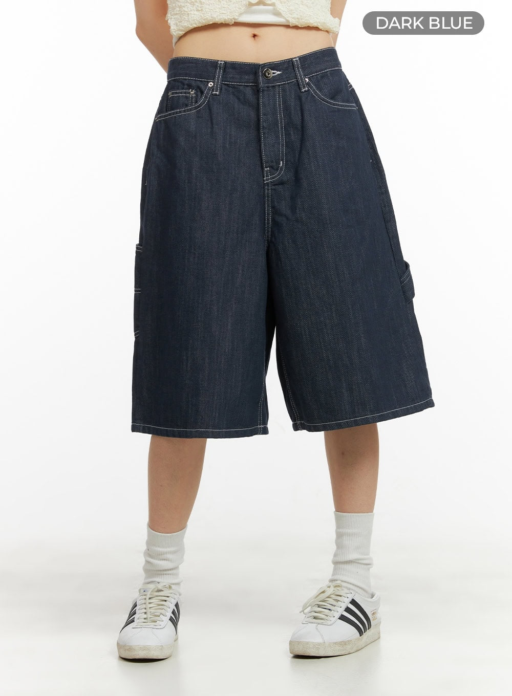Solid Wide-Leg Bermuda Jorts CY414 in dark blue, front cropped product shot on model, wide-fit midi denim with five-pocket design and contrast stitching, styled with white socks and sneakers.