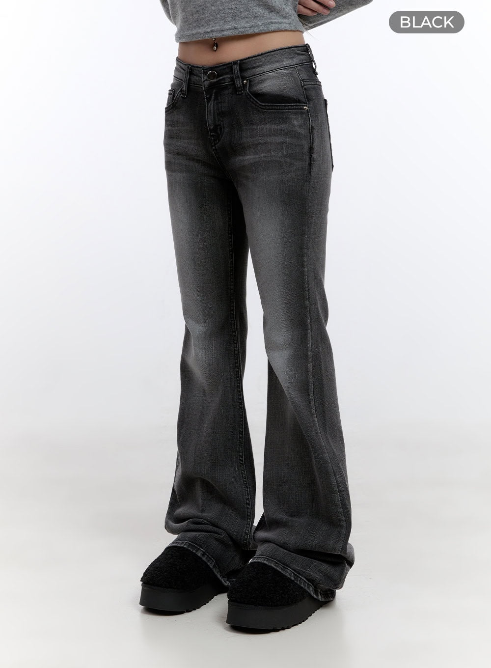 Gianna Faded Flared Jeans CO422 in Black, front diagonal close-up on model, low-rise slim washed cotton-spandex denim with wide flared leg, black colorway label visible.
