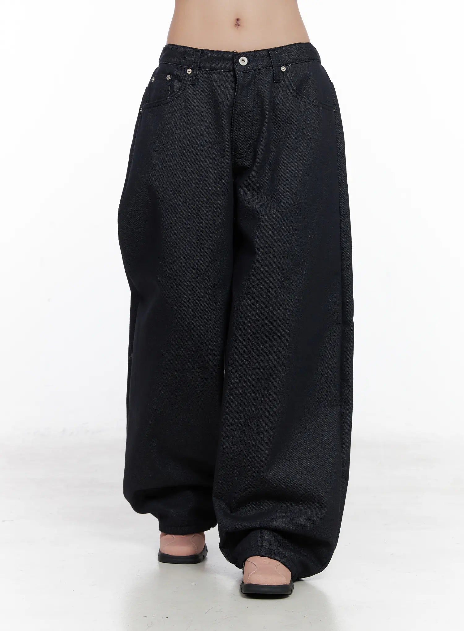 Solana Unwashed Wide-Leg Jeans CN514 in dark indigo, front full-length product shot on model, low-rise five-pocket wide leg, unwashed rigid denim with exaggerated balloon-leg shape.