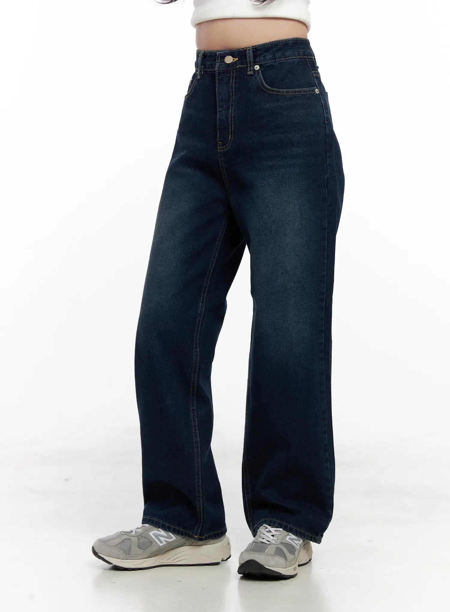 Shiloh Washed Semi-Wide Jeans CO524 in dark blue, angled front close-up on model, high-rise waist with button fly, contrast topstitching, and washed cotton texture visible.