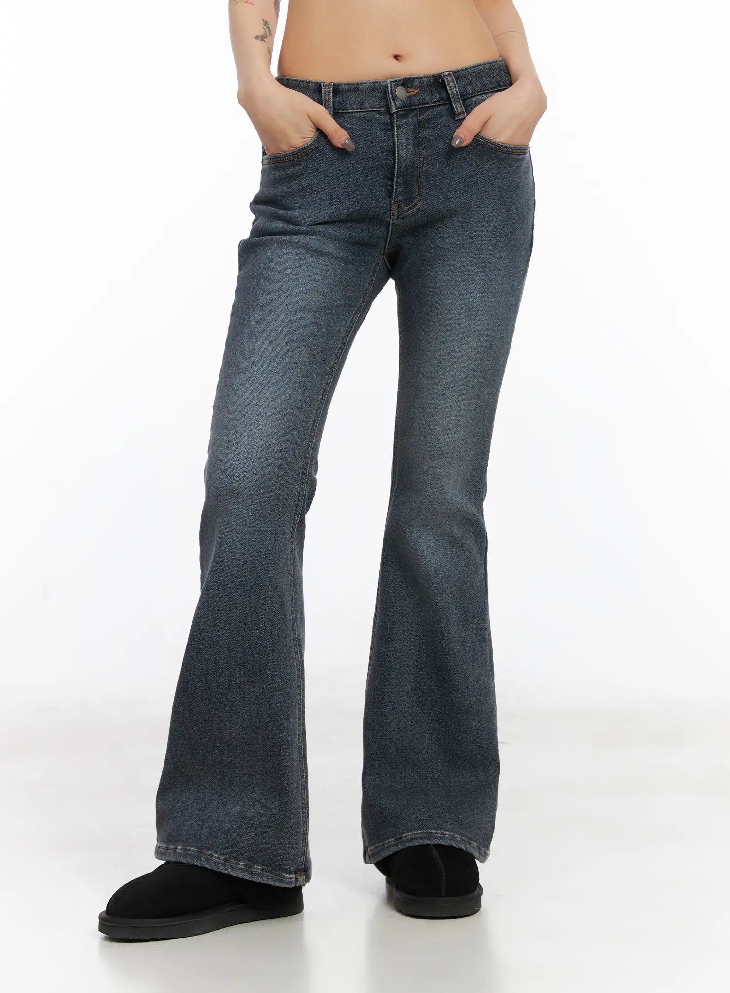 Kiera Low-Rise Fleece-Lined Bootcut Jeans CD509 in washed dark blue, front cropped waist-to-hem view on model, low-rise button closure, front pockets, washed cotton-spandex fabric with flared bootcut leg.
