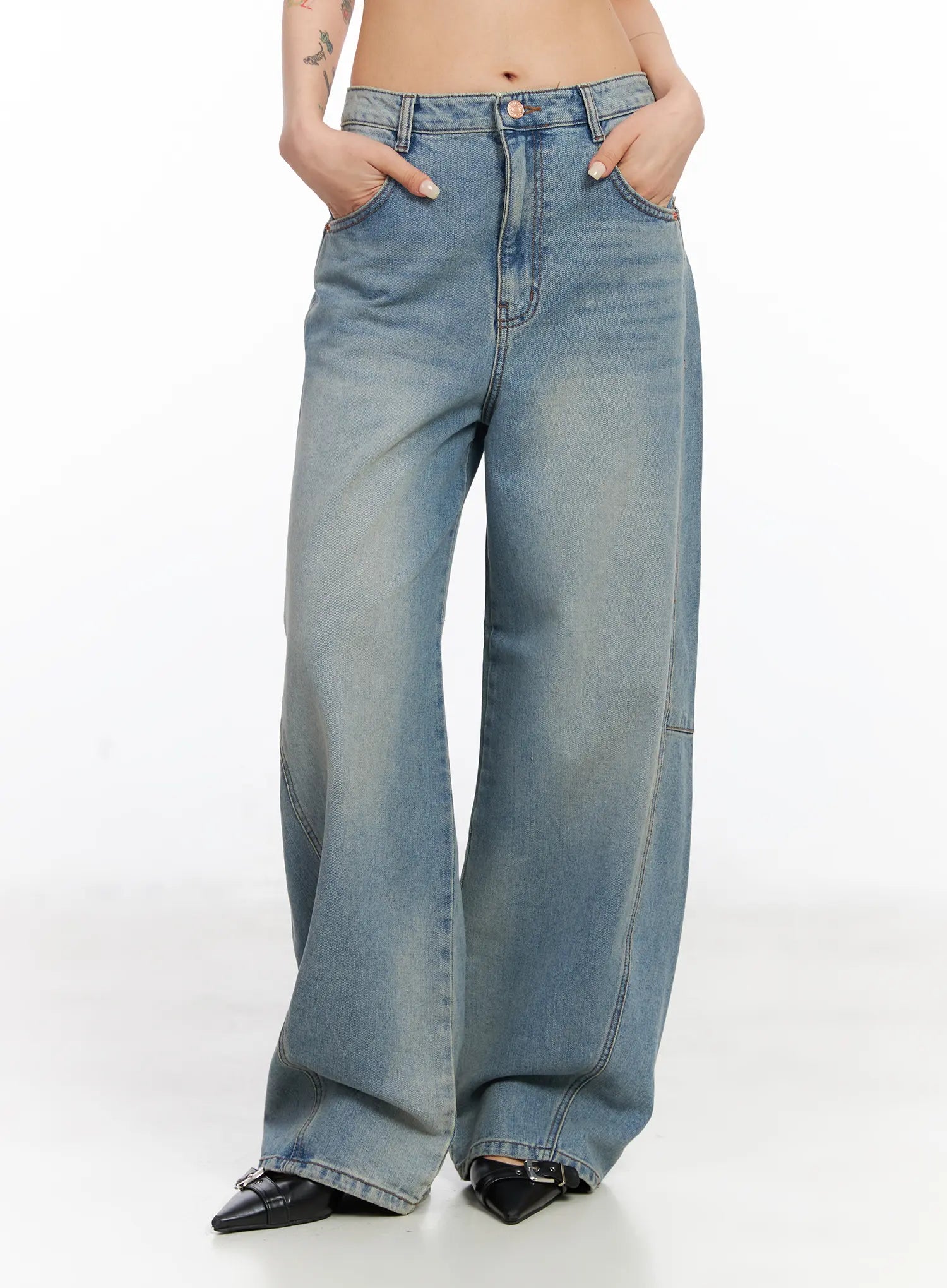 Frey Washed Wide-Leg Jeans CJ523 in light blue, front three-quarter view on model, hands in pockets, emphasizing high-rise fit, panel seams, and wide cotton leg.