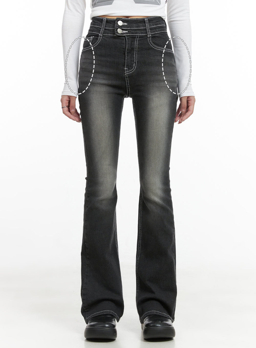 Gigi Two-Button Slim Bootcut Jeans CG421 in black, front annotated detail shot on model highlighting two-button waistband and front pocket placement with dashed circles, washed slim bootcut denim.