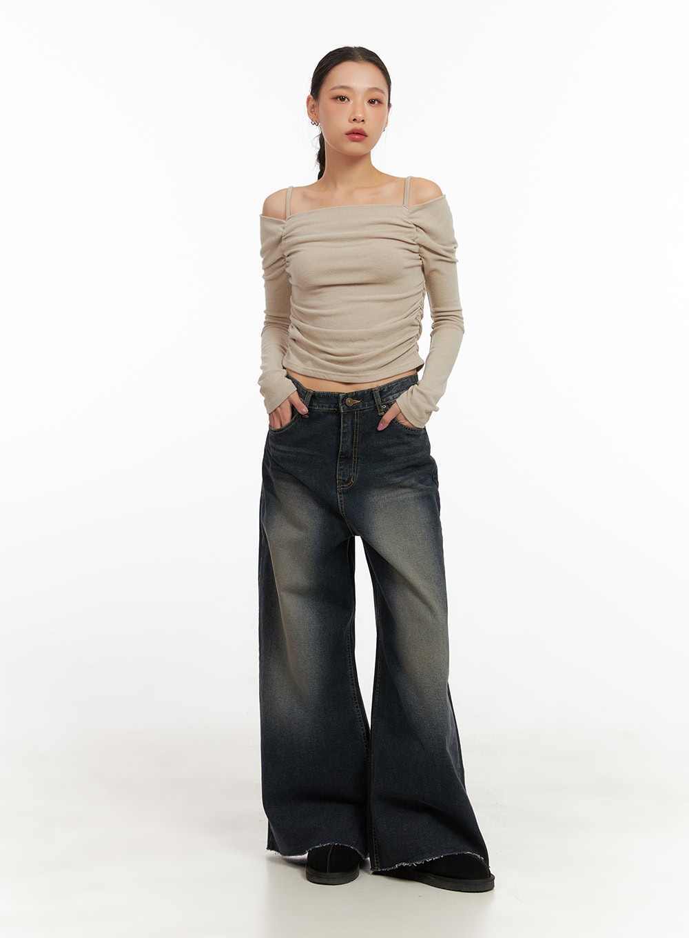 Tasha Low Waist Washed Wide Leg Jeans CD410 in dark blue, full-body front shot on model, low-rise washed wide-leg denim with floor-grazing raw hem, styled with beige off-shoulder ruched long-sleeve top.
