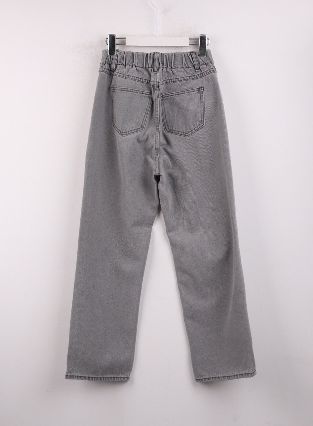 Low-Rise Straight Leg Jeans OJ426 in gray, flat back hanger shot, showing elastic banded waistband, two back patch pockets with topstitching, and straight wide-leg cut.
