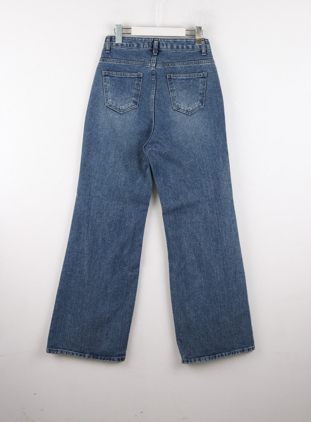 Wide Leg Jeans J12 in blue, flat hanger back product shot, wide-leg cotton denim with gradation wash, two back patch pockets and clean seam construction visible.