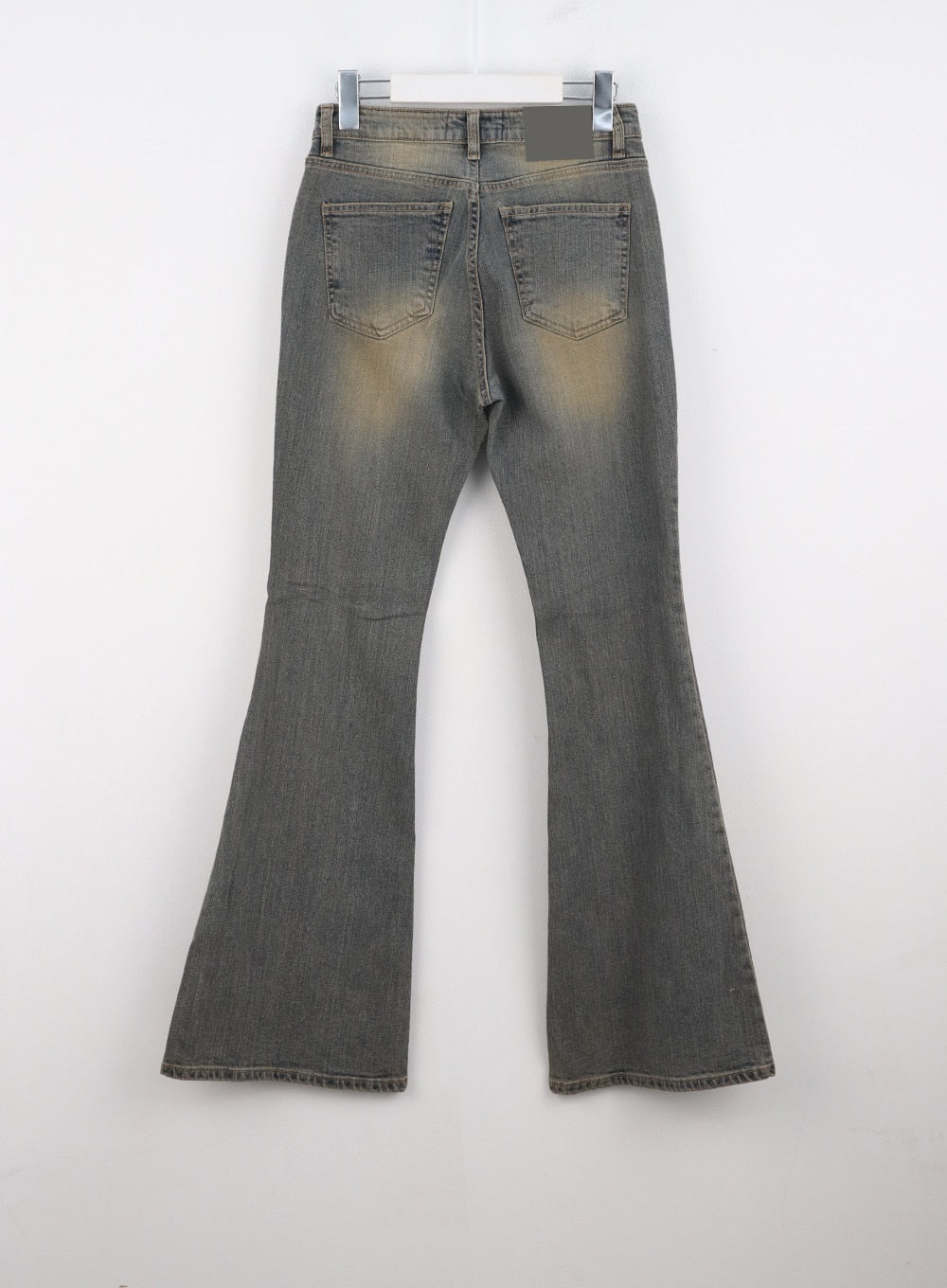 Stitched Bootcut Jeans CO313 in Blue, flat back hanger shot, revealing rear pockets, amber washed fading on seat, and bootcut flare hem of slim-fit cotton-spandex denim.