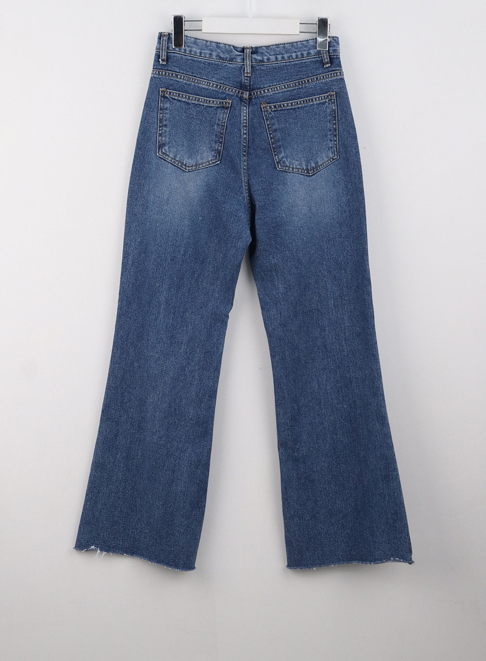 Straight-Leg Jeans OG318 in dark blue, flat product back shot on hanger, two back patch pockets with contrast stitching, straight-leg cotton denim, faded wash, raw frayed hem detail.