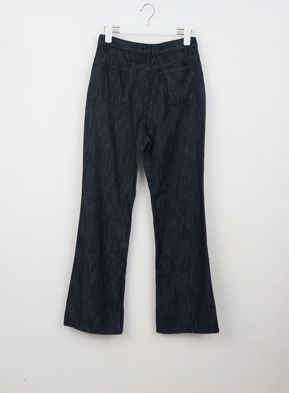 Dark Wash Mid-Rise Jeans OU314 in dark blue, flat back hanger shot, back patch pockets with stitching, bootcut flare hem, and dark wash cotton denim texture.