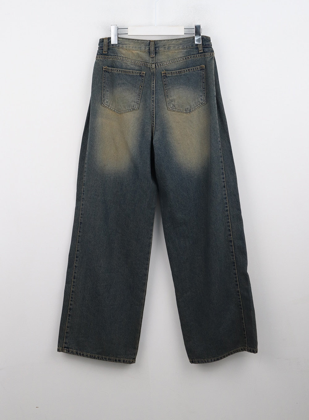 Washed Wide Leg Jeans CN315 in dark blue, flat back product shot on hanger, two back pockets with yellow-toned washed denim detail and wide straight leg cut.
