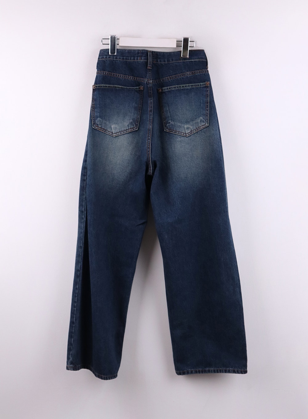 Wide Leg Washed Denim Jeans CF407 in blue, flat back product shot on hanger, dual back pockets with contrast stitching and washed denim texture, wide-leg cut shown from behind.
