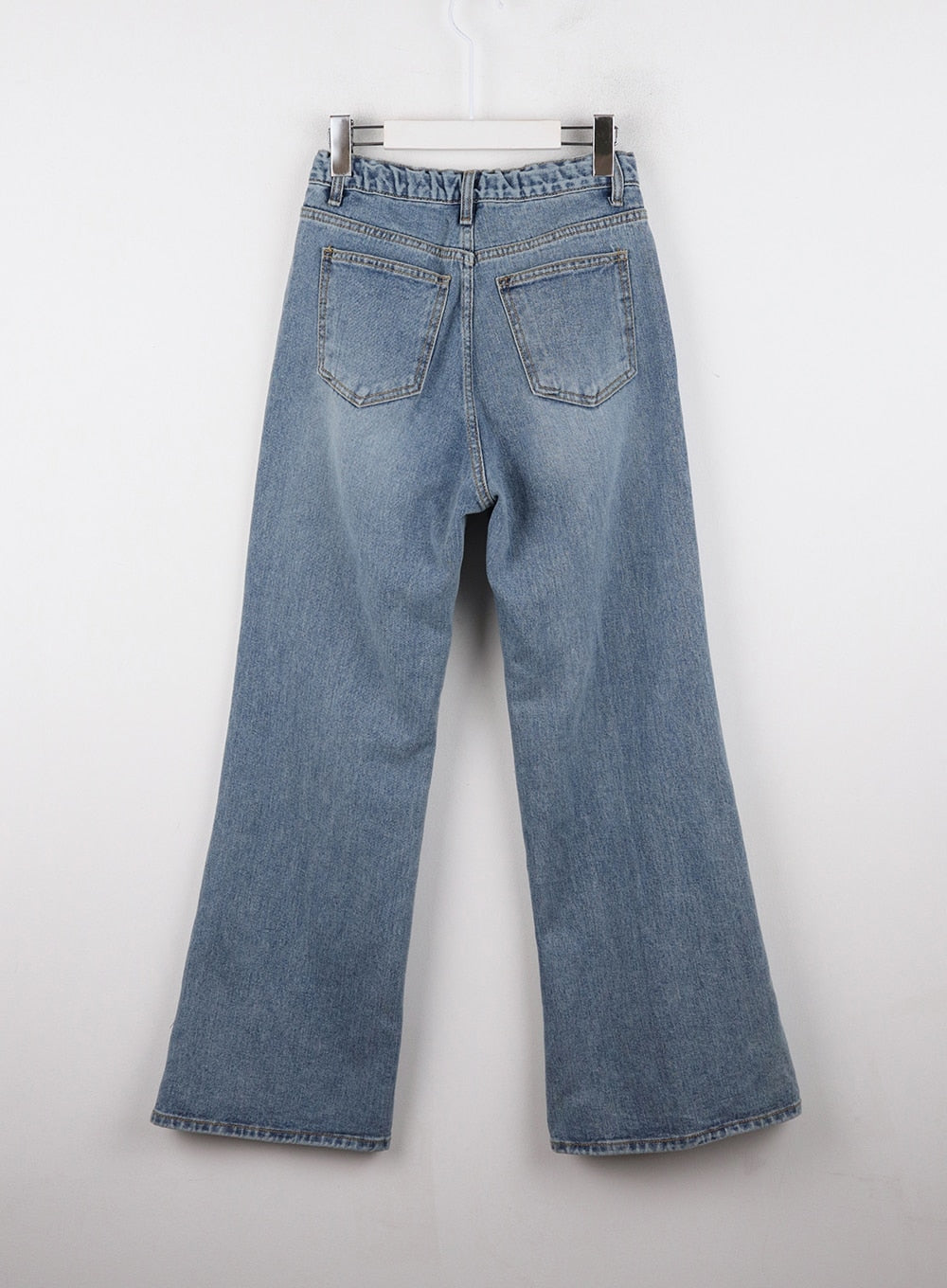 Casual Denim Solid Straight Leg Jeans OD326 in blue, flat back product shot on hanger, rear patch pockets with topstitching, washed cotton wide-leg cut with slight bootcut flare at hem.