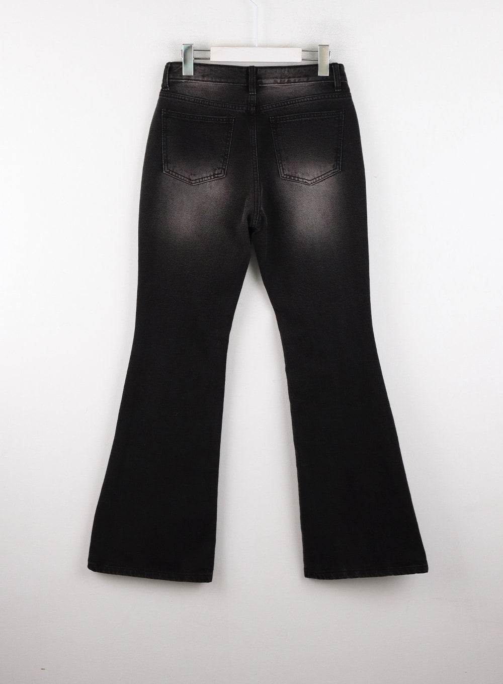 Low Rise Bootcut Jeans CD304 in black, flat back product shot on hanger, rear patch pockets with stitching detail, washed fade at seat, bootcut hem width clearly visible.