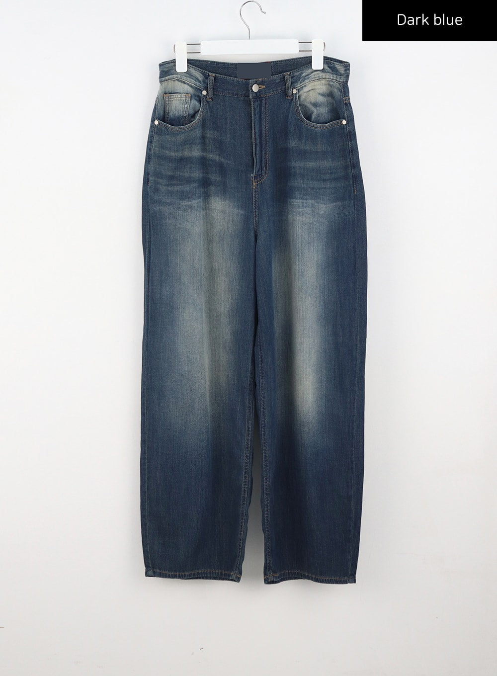 Baggy Low Rise Jeans CA326 in dark blue, flat front hanger shot, five-pocket low-rise wide-leg denim with vintage fading and sun-bleached thigh wash, silver rivets visible.
