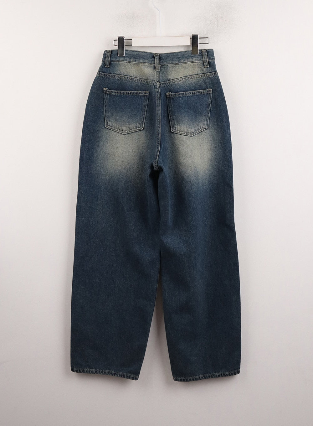 Wide Leg Denim Trousers CJ415 in dark blue, flat back hanger shot, dual patch pockets with vintage sun-fading, wide-leg silhouette and clean hem.