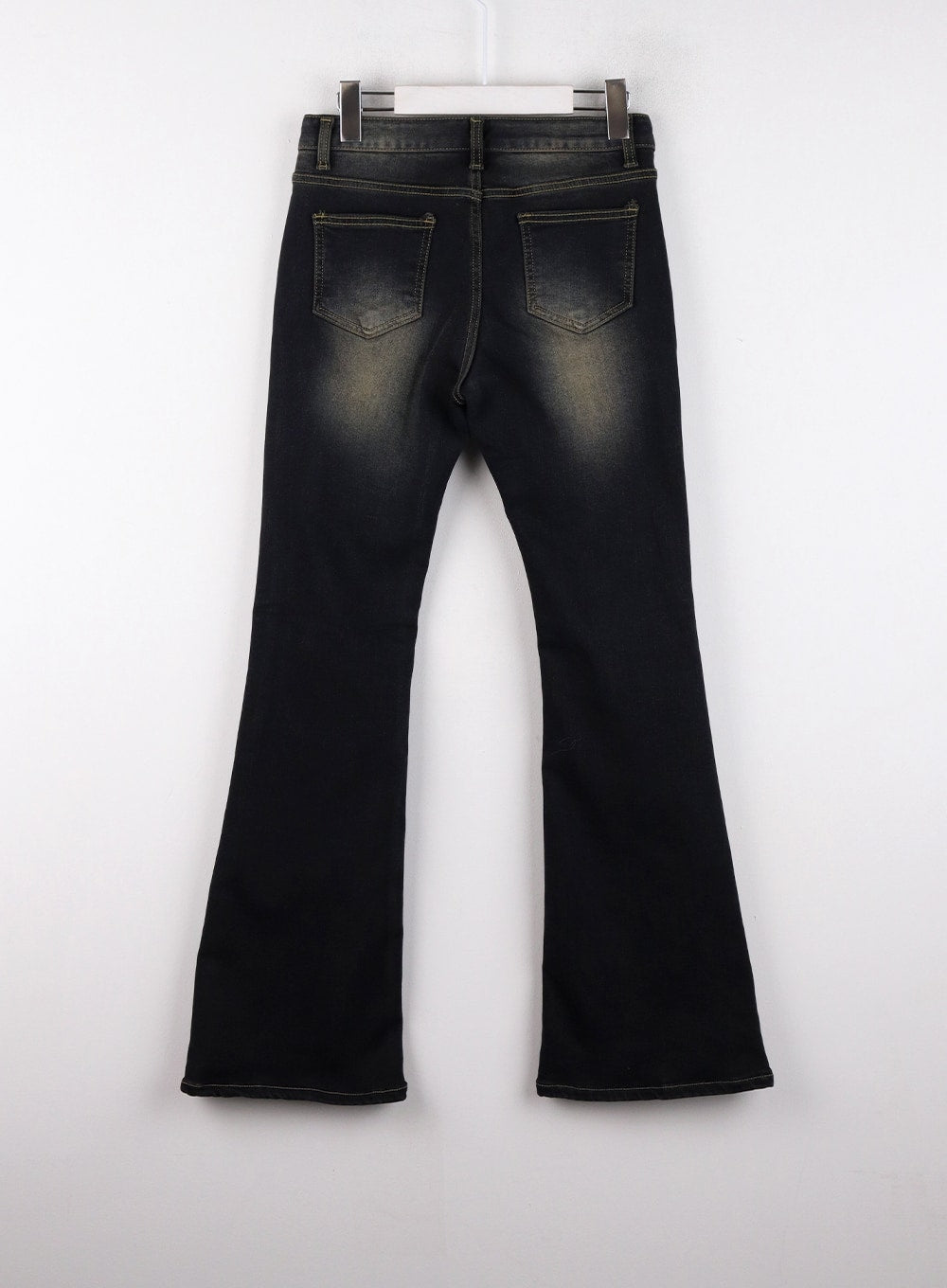 Washed Low Rise Bootcut Jeans CD308 in dark blue, flat back product shot on hanger, dual rear patch pockets with contrast stitching, vintage wash fading at seat and bootcut flare shown.