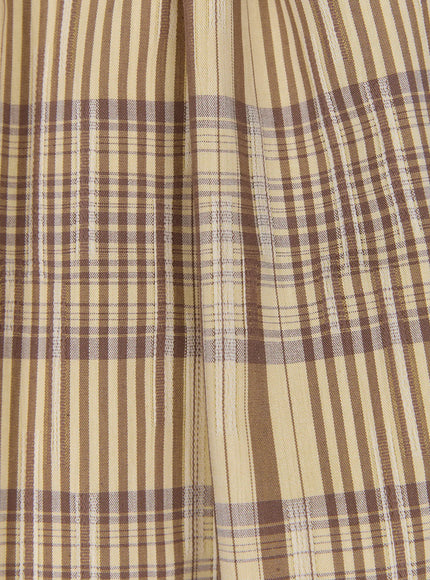 Plaid Layered Midi Skirt CU519 fabric macro close-up in beige-brown colorway, woven plaid texture with gathered pleats detail, warm cream and brown check weave visible.
